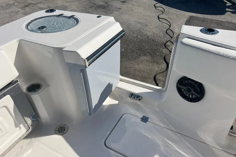 Slide: The Image of 2025 Robalo R270 Center Console boat interior with speaker and storage compartments. - 17