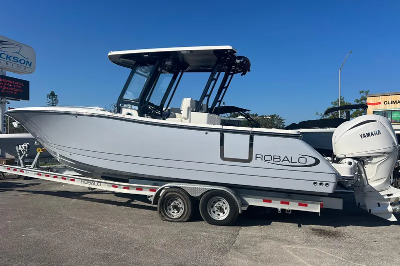 Slide: The Image of 2025 Robalo R270 Center Console boat on trailer, featuring Yamaha engine. - 3