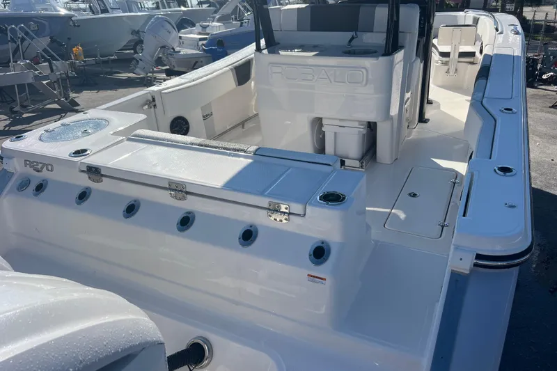 Slide: The Image of 2025 Robalo R270 Center Console boat, sleek design, spacious deck, modern features. - 6