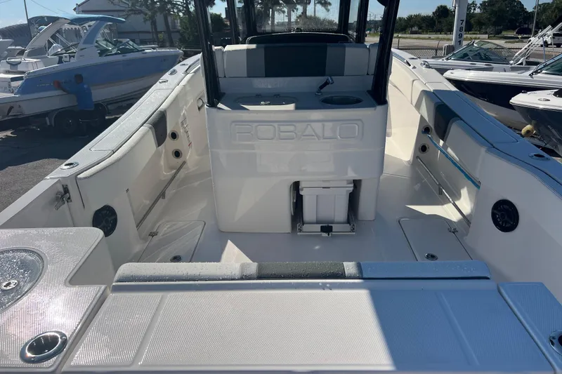 Slide: The Image of 2025 Robalo R270 Center Console boat interior with seating and storage features. - 7