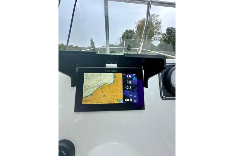 Slide: The Image of Simrad navigation display on 2024 Boston Whaler 170 Montauk boat dashboard. - 11
