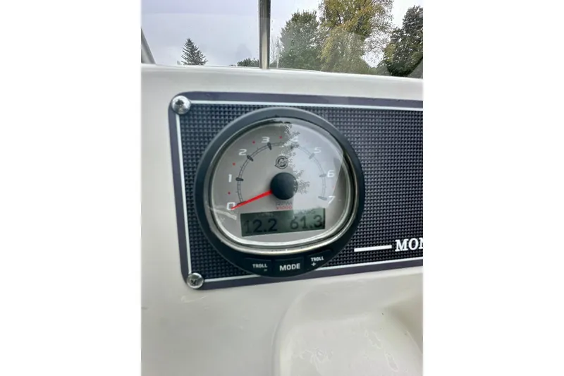 Slide: The Image of Dashboard of 2024 Boston Whaler 170 Montauk boat showing speedometer and digital display. - 12