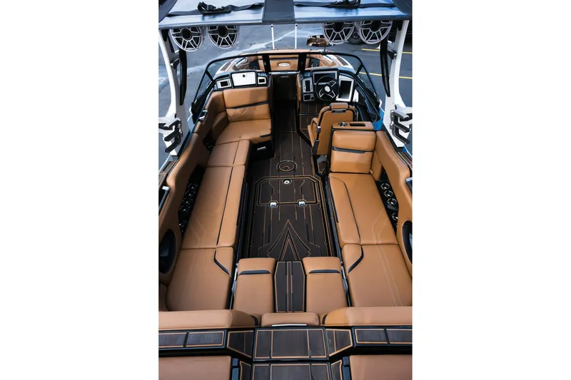 Slide: The Image of 2023 Supra SE550 boat interior with luxurious tan seating and modern design. - 11