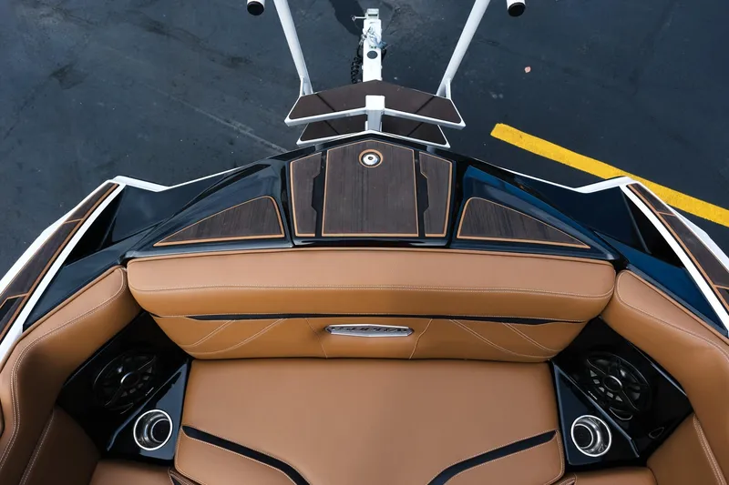 Slide: The Image of 2023 Supra SE550 boat interior with tan leather seats and sleek design. - 18