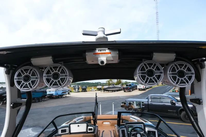 Slide: The Image of 2023 Supra SE550 boat with premium audio system and sleek interior design. - 27