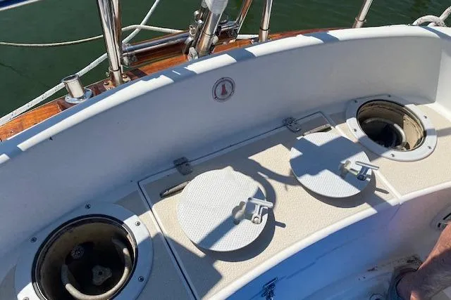 Slide: The Image of Cockpit of 1989 Tartan 37 sailboat with storage compartments and railing. - 17