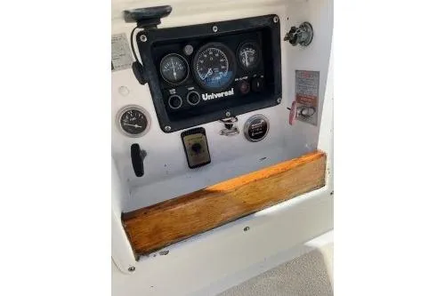 Slide: The Image of Control panel of a 1989 Tartan 37 sailboat with gauges and switches. - 23