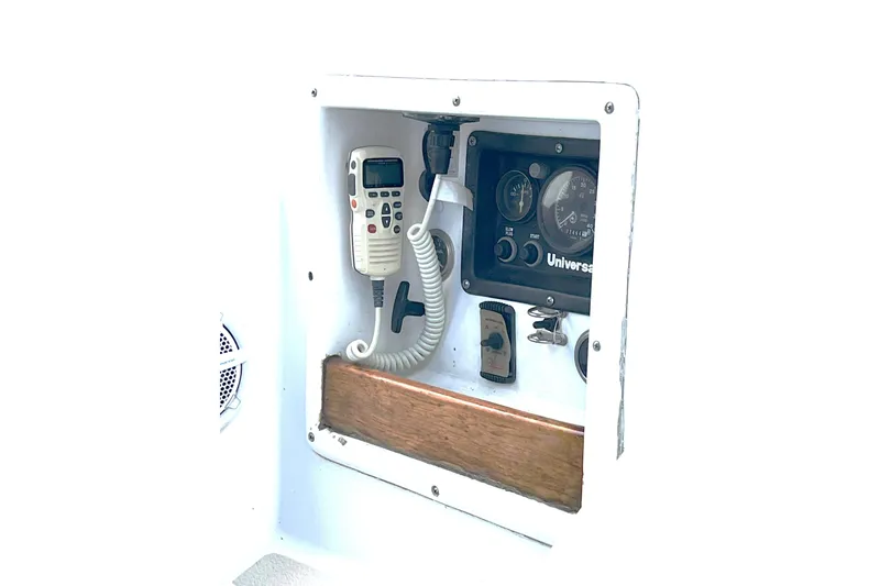 Slide: The Image of Control panel of a 1989 Tartan 37 sailboat with radio and gauges. - 24