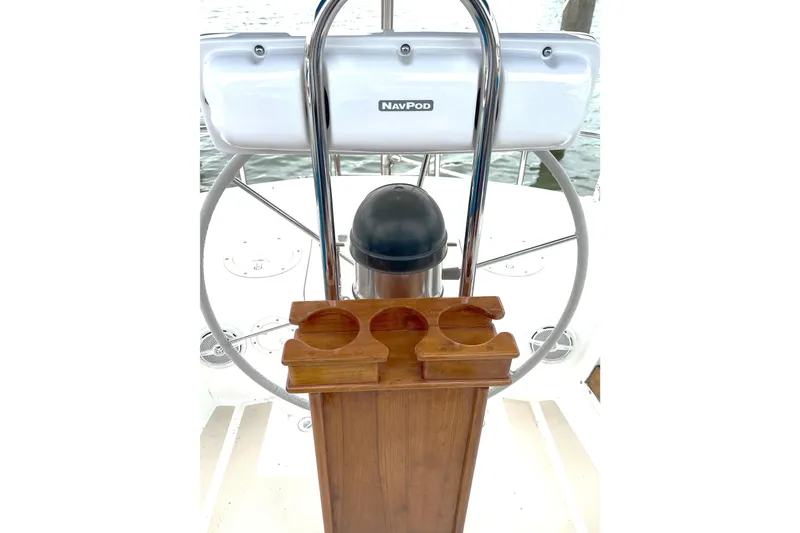 Slide: The Image of Steering wheel and console of 1989 Tartan 37 sailboat with NavPod and cup holders. - 26