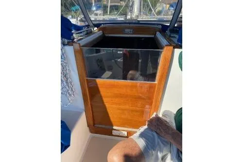 Slide: The Image of 1989 Tartan 37 sailboat interior with wooden hatch and seating area. - 34