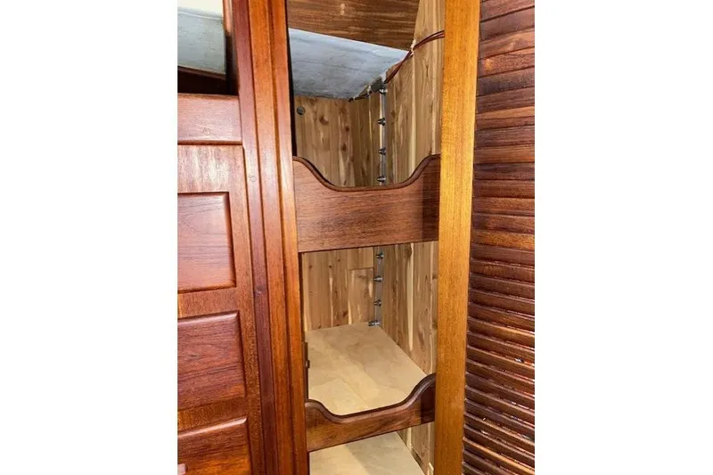 Slide: The Image of Wooden interior shelving in a 1989 Tartan 37 sailboat cabin. - 40