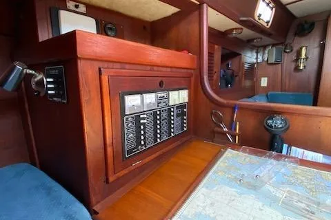 Slide: The Image of 1989 Tartan 37 yacht interior with navigation station and control panel. - 45
