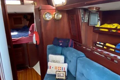 Slide: The Image of Interior of 1989 Tartan 37 sailboat with cozy seating and nautical decor. - 50