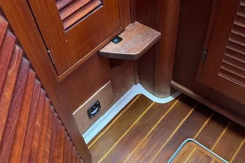 Slide: The Image of Interior of 1989 Tartan 37 sailboat with wooden paneling and flooring. - 51