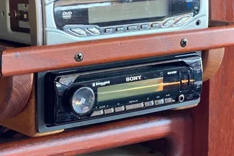 Slide: The Image of Sony car stereo system in a 1989 Tartan 37, mounted on wooden dashboard. - 52
