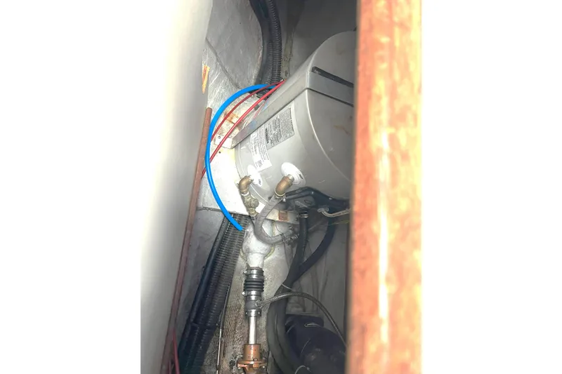 Slide: The Image of 1989 Tartan 37 engine compartment with visible wiring and components. - 59