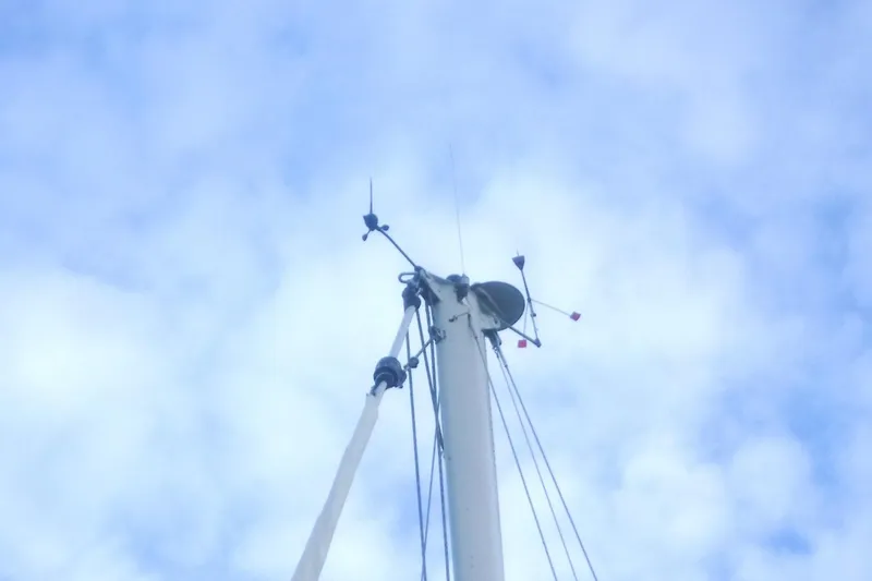 Slide: The Image of Mast of 1989 Tartan 37 sailboat against cloudy sky. - 8