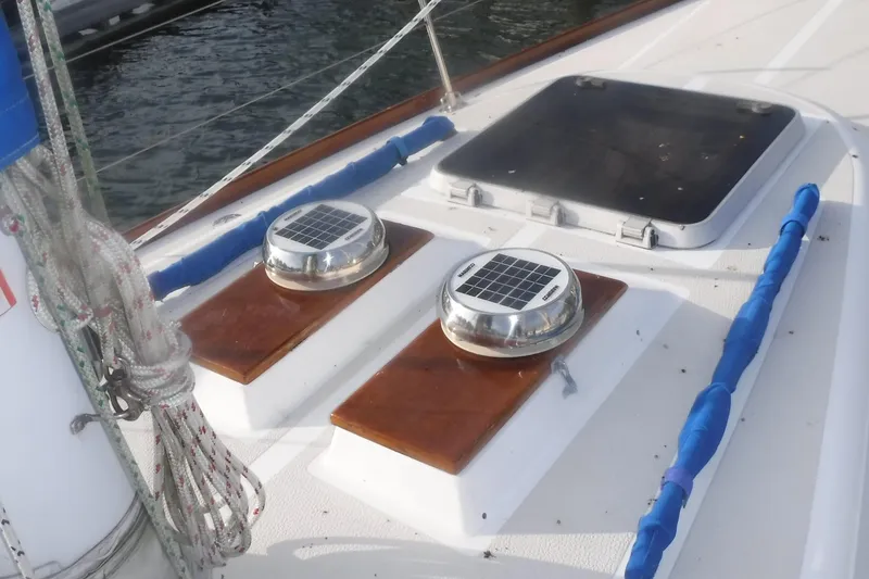 Slide: The Image of 1989 Tartan 37 sailboat deck with solar vents and hatch. - 9