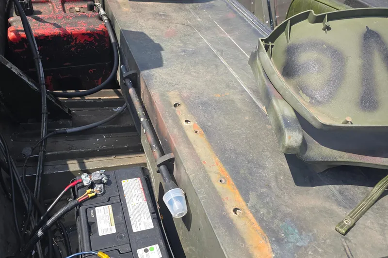 Slide: The Image of 1989 Polar Kraft 17 boat interior with battery and wiring components. - 4