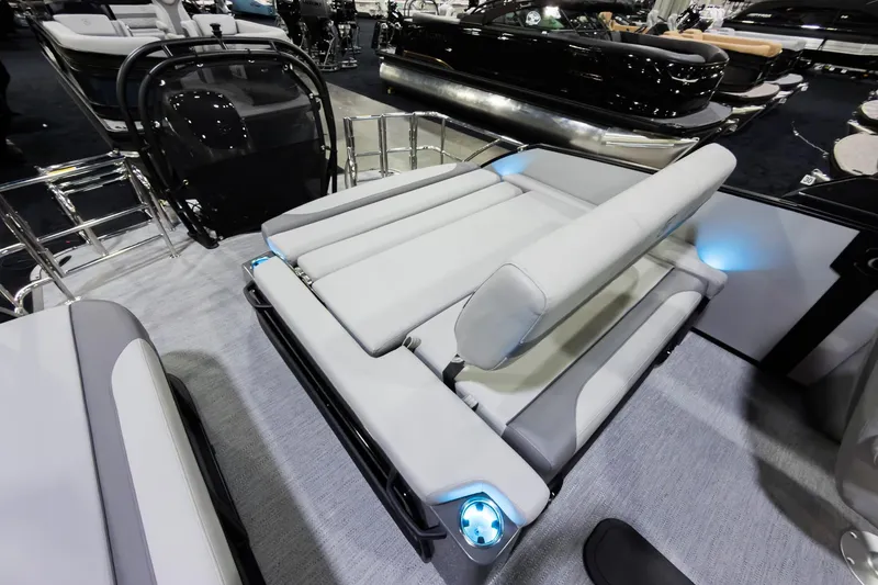 Slide: The Image of 2026 Godfrey Monaco 25' Tritoon with flip lounge seating, showcasing modern design and comfort. - 22