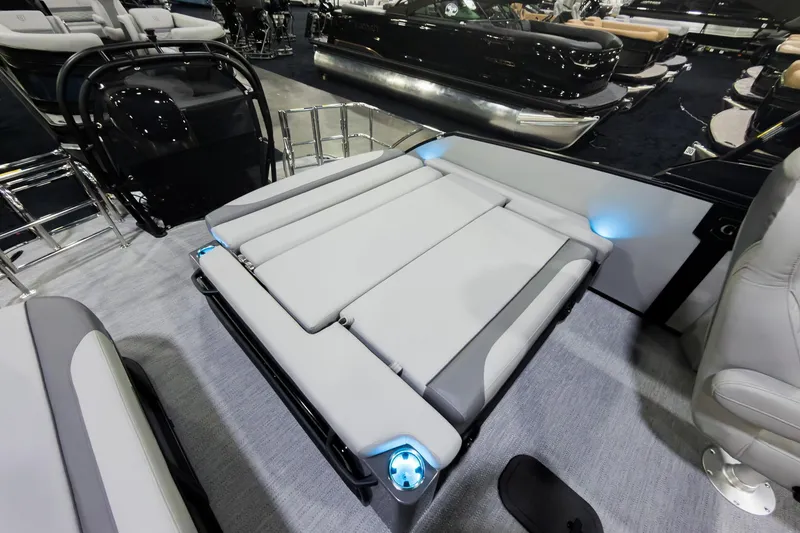 Slide: The Image of 2026 Godfrey Monaco 25' Tritoon with flip lounge seating, showcasing modern design and comfort. - 23