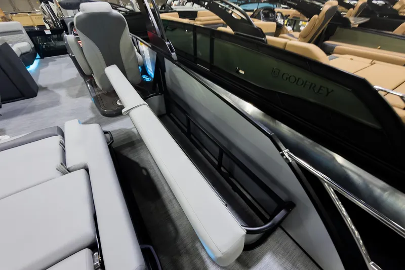 Slide: The Image of Interior of 2026 Godfrey Monaco 25' Tritoon with flip lounge seating. - 28