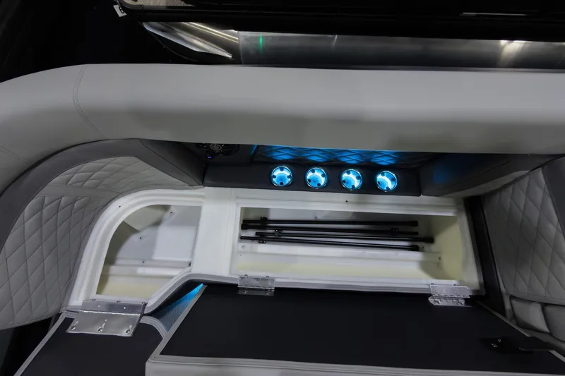 Slide: The Image of Interior view of 2026 Godfrey Monaco 25' Tritoon with illuminated storage compartment. - 9