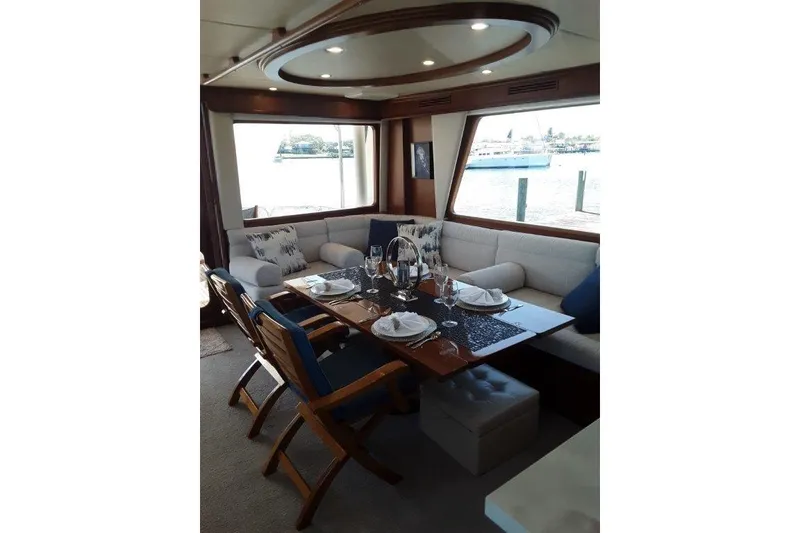 Slide: The Image of Luxurious interior of 2008 Offshore Yachts 62 Flushdeck with elegant dining setup. - 16