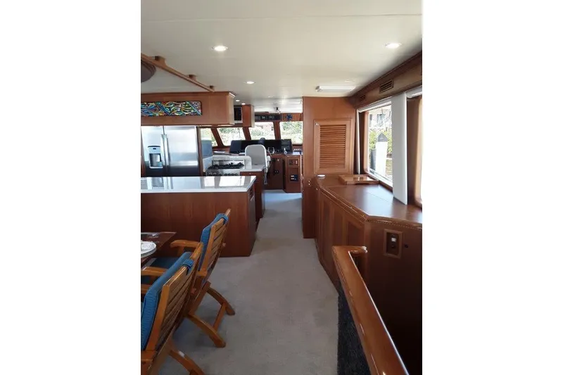 Slide: The Image of Luxurious interior of 2008 Offshore Yachts 62 Flushdeck, featuring elegant wood finishes and modern amenities. - 18