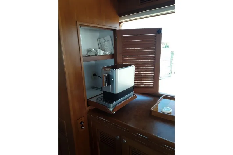 Slide: The Image of Coffee machine in wooden cabinet aboard 2008 Offshore Yachts 62 Flushdeck. - 22