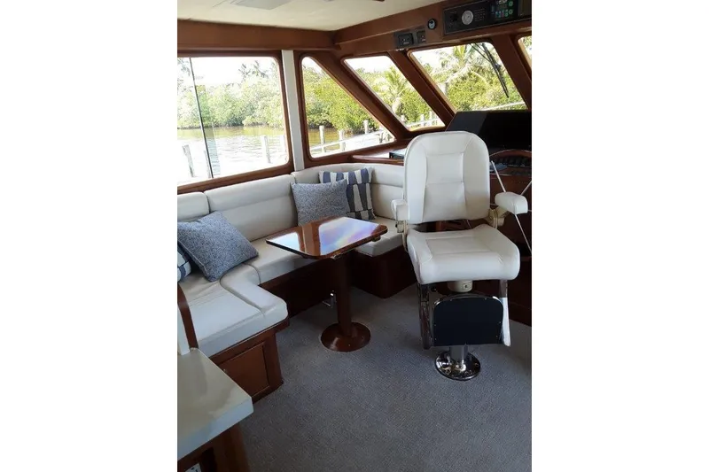 Slide: The Image of Luxurious interior of 2008 Offshore Yachts 62 Flushdeck with plush seating and helm chair. - 24