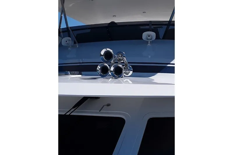 Slide: The Image of 2008 Offshore Yachts 62 Flushdeck yacht with chrome air horns on deck. - 3