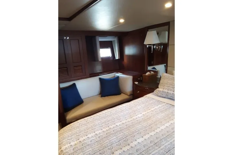 Slide: The Image of Master stateroom couch with cozy seating and elegant decor. - 30