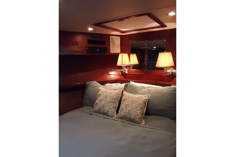 Slide: The Image of VIP stateroom forward with queen bed and elegant lighting and decor. - 31
