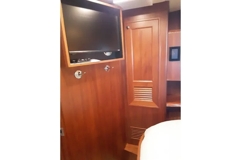 Slide: The Image of Aft VIP stateroom with mounted TV. This room has full access to the engine room - 32