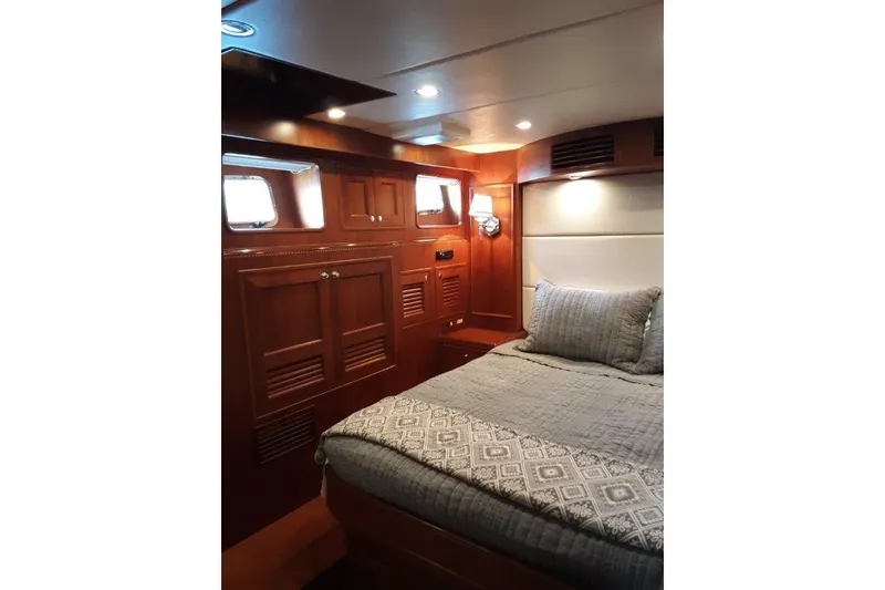 Slide: The Image of Luxurious cabin interior of 2008 Offshore Yachts 62 Flushdeck with elegant wood paneling. - 35