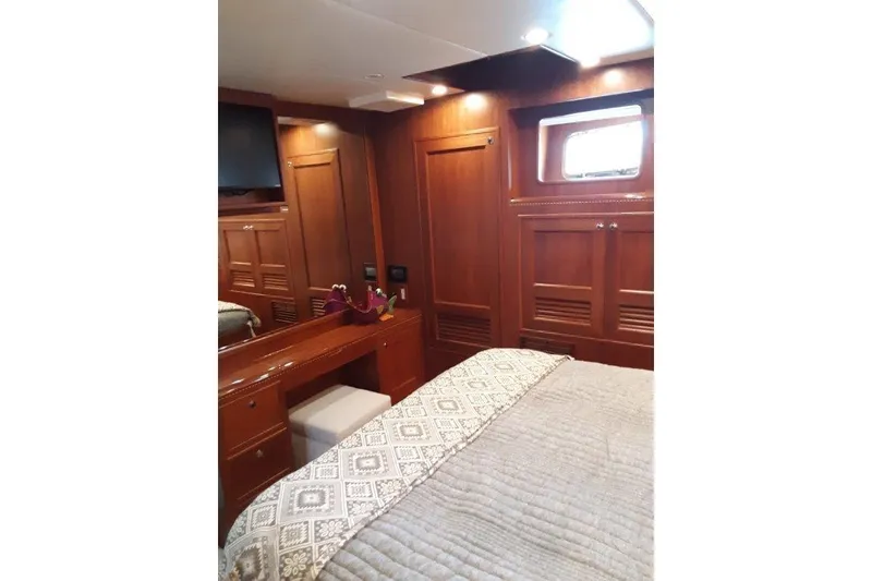Slide: The Image of Luxurious 2008 Offshore Yachts 62 Flushdeck cabin with elegant wood interior and cozy bedding. - 36