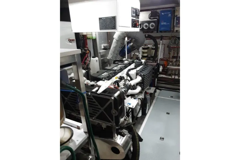 Slide: The Image of Engine room of 2008 Offshore Yachts 62 Flushdeck, showcasing mechanical components and systems. - 47