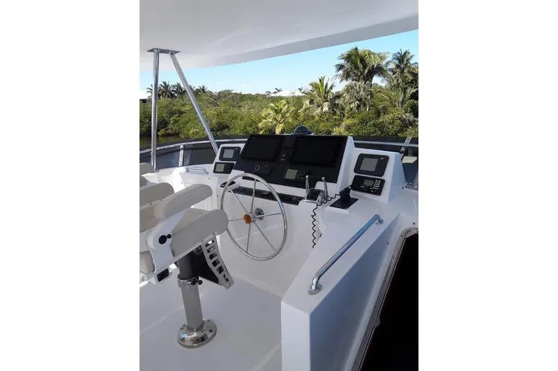 Slide: The Image of Flybridge Helm of 2008 Offshore Yachts 62 Flushdeck with navigation equipment and steering wheel. - 5