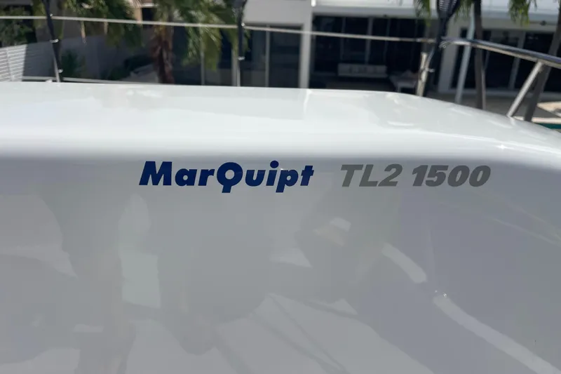 Slide: The Image of MarQuipt TL2 1500 label on 2008 Offshore Yachts 62 Flushdeck. - 53