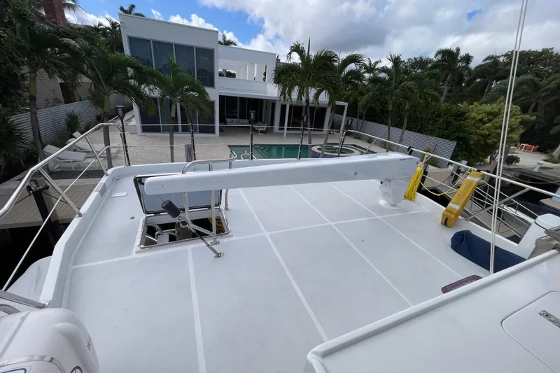 Slide: The Image of 2008 Offshore Yachts 62 Flushdeck yacht deck with modern house and pool view. - 59
