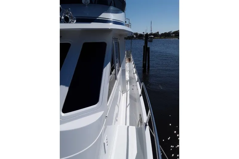 Slide: The Image of 2008 Offshore Yachts 62 Flushdeck, side view on calm water. - 6