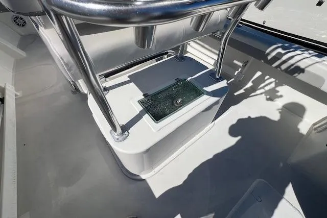 Slide: The Image of 2022 Parker 2100 Special Edition boat interior with stainless steel fixtures and storage compartment. - 10