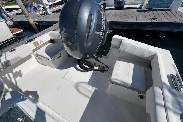 Slide: The Image of 2022 Parker 2100 Special Edition boat with Yamaha outboard engine at dock. - 11