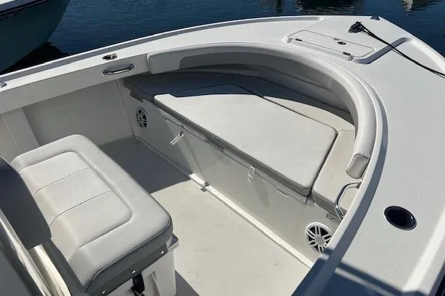 Slide: The Image of 2022 Parker 2100 Special Edition boat interior with cushioned seating and speakers. - 16
