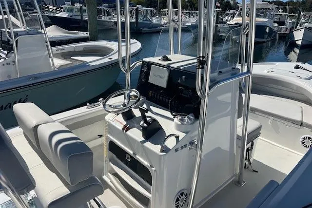 Slide: The Image of 2022 Parker 2100 Special Edition boat interior with steering console and seating. - 17