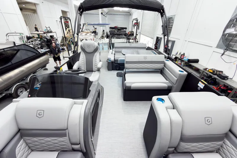 Slide: The Image of Luxurious interior of 2026 Godfrey Monaco 25' Tritoon with plush seating and modern design. - 19