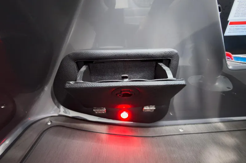 Slide: The Image of Storage compartment with red light on 2026 Godfrey Monaco 25' Tritoon boat. - 25