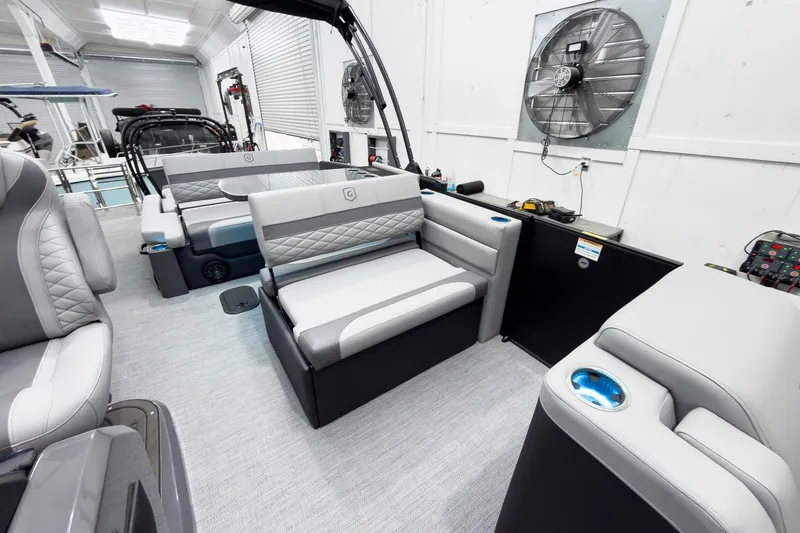 Slide: The Image of Interior of 2026 Godfrey Monaco 25' Tritoon with luxurious seating and modern amenities. - 32