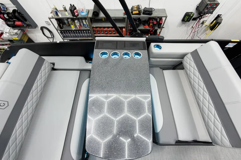 Slide: The Image of Luxurious interior of 2026 Godfrey Monaco 25' Tritoon with stylish seating and illuminated table. - 36